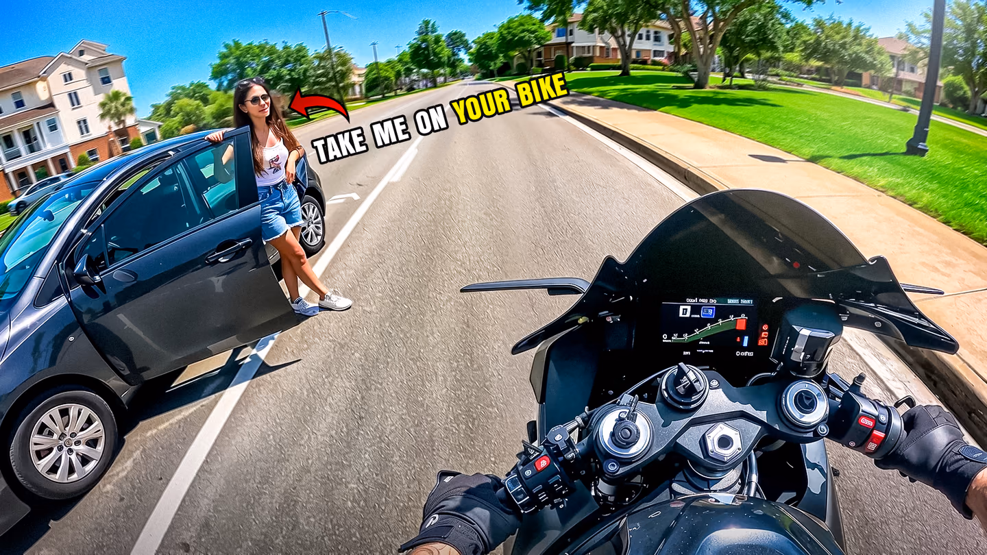 A motorcyclist point-of-view faces a woman beside a BMW beneath a take me on your bike quote.